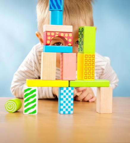 Little-boy-looking-through-blocks-2